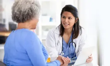 Family Nurse Practitioner with MSN Speaking with Patient